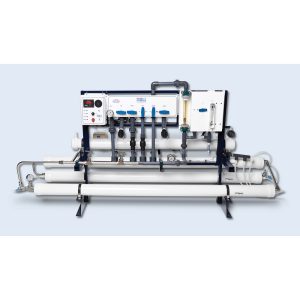 Watermakers | Advanced Reverse Osmosis Desalination Systems - Watermaker WMFQ-7500 reverse osmosis desalination system in a frame configuration. White machine with pipes, dials, buttons and gauges.
